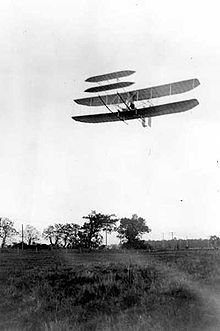 Aviation History - The Wright Brothers - Wright Flyer III piloted by Orville over Huffman Prairie, October 4, 1905. Flight #46, covering 20 and 3/4 miles in 33 minutes 17 seconds; last photographed flight of the year