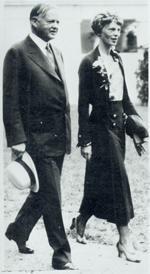 Aviation History - Earhart walking with President Hoover in the grounds of the White House on January 2, 1932