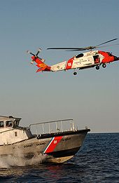 Helicopter Picture - HH-60J Jayhawk (USCG Registration Number 6034) and a 47-foot motor life boat