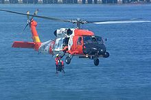 Helicopter Picture - HH-60J Jayhawk (USCG Registration Number 6022) retrieving a rescue swimmer.