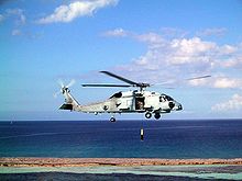 Helicopter Picture - An MH-60R conducts sonar operations.