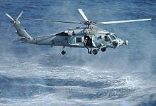 Helicopter Picture - An HH-60H deploying a SAR swimmer