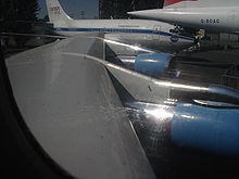 Airplane Picture - 707-120B (VC-137B) wing, showing the new inboard leading edge from the 720. Also, note the British Airways Concorde G-BOAG to the side.