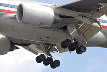 Airplane Picture - Engines, extended slats, flaps, and landing gear of an American Airlines 777-200ER