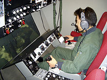 Airplane Picture - A Japan Air Self Defense Force boom operator crewman simulates refueling an aircraft at Travis AFB.