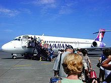 Airplane Picture - A Hawaiian Airlines 717 boarding at Kona International Airport, Hawaii for an interisland flight in 2004.