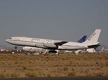 Airplane Picture - Omega Air's 707-330C testbed for the 707RE program takes off from the Mojave Airport