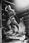 World War 1 Picture - The casting of the figure atop the memorial at Mont St. Quentin memorial -- Charles Gilbert's studio in, Fitzroy, Melbourne.