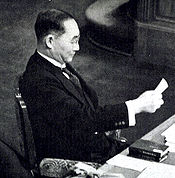 World War 1 Picture - Yonai reading a memo during the House plenary session in February 1940.