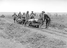 World War 1 Picture - 5th Australian Field Ambulance Company soldiers evacuating wounded from the front near Ypres in trench railway hand cars.