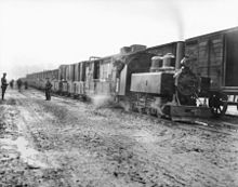 World War 1 Picture - Transfer of ammunition from standard-gauge railway to trench railway during the Battle of Passchendaele.