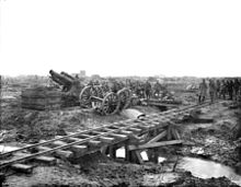 World War 1 Picture - BL 9.2 inch Howitzer with shells lined up on the ground recently delivered from the trench railway in the foreground.