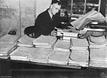 World War 1 Picture - Bean studying Army documents while working on the official history in 1935