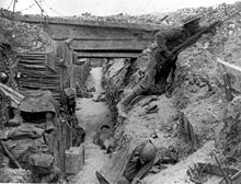 World War 1 Picture - Trenches of the 11th Cheshire Regiment at Ovillers-la-Boisselle, on the Somme, July 1916. One sentry keeps watch while the others sleep. Photo by Ernest Brooks.