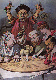 World War 1 Picture - China imperialism cartoon-while a Mandarin official helplessly looks on, China as a pie is about to be carved up by Queen Victoria (British Empire), Wilhelm II (German Empire), Nicolas II (Russian Empire), Marianne (France), and a samurai (Japanese Empire)