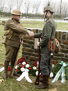 World War 1 Picture - Descendants of Great War veterans, in period uniforms, shake hands at the 2008 unveiling of a memorial to the truce.