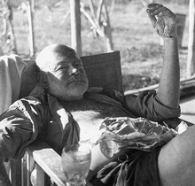 World War 1 Picture - Hemingway at a fishing camp. His hand and arms are burned from a recent brushfire; his hair burned from the recent plane crashes.