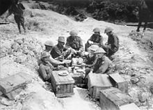 World War 1 Picture - Gellibrand and his staff having breakfast in a shell hole in Sausage Valley.