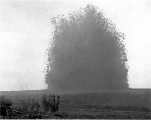 World War 1 Picture - Explosion of the Hawthorn Ridge mine, 7:20 am, 1 July 1916. A still from one of the earliest examples of combat photography to remain unedited. Photo by Ernest Brooks.