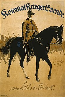 World War 1 Picture - World War I poster of German General Paul von Lettow-Vorbeck on horseback leading African soldiers. Text at top reads Colonial War Funds; on bottom is facsimile of von Lettow-Vorbeck's signature