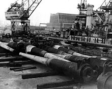 World War 1 Picture - Guns from battleships being scrapped in Philadelphia Navy Yard in December 1923. USS South Carolina being dismantled in the background.