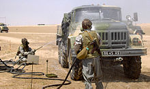 World War 1 Picture - Members of the Ukrainian Army’s 19th Nuclear, Biological and Chemical Battalion practice decontamination drill, at Camp Arifjan, Kuwait