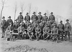 World War 1 Picture - Group portrait of the officers and NCOs of the 24th Machine Gun Company in March 1918. Sergeant Cedric Popkin is second from the right in the middle row.