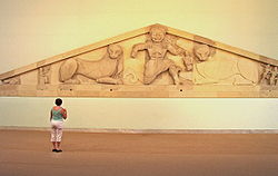 World War 1 Picture - The Gorgon just before being beheaded by Perseus, as depicted on a pediment from the Artemis Temple on display at the Archaeological Museum of Corfu.