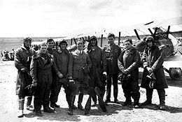 World War 1 Picture - King (fourth from right), Captain Harry Cobby (centre) and officers of No. 4 Squadron AFC with their Sopwith Camels, Western Front, June 1918