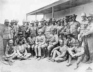 World War 1 Picture - Officers of the Queensland Mounted Infantry. Chauvel is squatting in the front row, second from the right, holding a rifle.