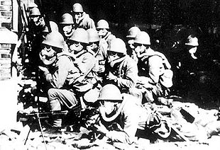 World War 1 Picture - Imperial Japanese soldiers wearing gas masks and rubber gloves during a chemical attack in the Battle of Shanghai.