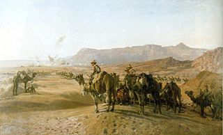 World War 1 Picture - Mounted troops of the Imperial Camel Corps Brigade with the Egyptian town of Magdhaba in the distance, 23 December 1916