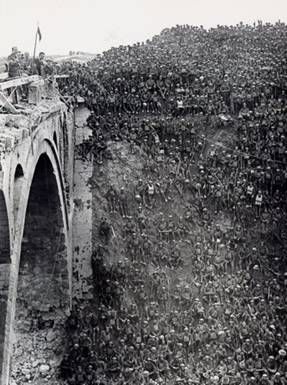 World War 1 Picture - Brigadier General J V Campbell addressing troops of the 137th Brigade (46th Division) from the Riqueval Bridge over the St Quentin Canal