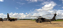 World War 1 Picture - A Royal Thai Air Force G.222 during an emergency evacuation exercise at COBRA GOLD '01, with a US Army UH-60Q Black Hawk MEDEVAC helicopter