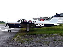 World War 1 Picture - Piper PA-28R-200 Cherokee Arrow showing the landing gear doors that distinguish this retractable gear model