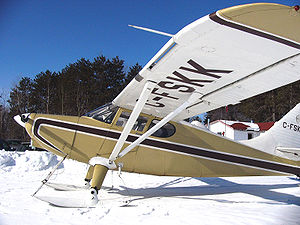 Airplane Picture - A Canadian 1949 model Stinson 108-3 on skis. The partial span leading edge slot is visible