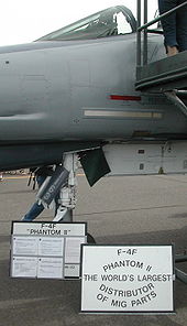 Airplane Picture - An F-4F on display described as the World's largest distributor of MiG parts, because of the high number of this type of enemy aircraft shot down
