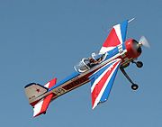 Airplane Pictures - Yak-55 performing low level airshow aerobatics. (Pilot Mark Hensman)