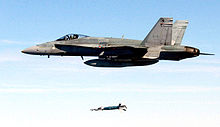 Airplane Picture - A Canadian CF-18A Hornet from the 409th Squadron at Cold Lake, Alberta, Canada, releases a laser-guided bomb at Eglin Air Force Base, Florida, USA, in December 2006.