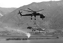 Airplane Picture - A CH-54 Tarhe lifting an F-100A to Hill Air Force Base, Utah for static display, 1979