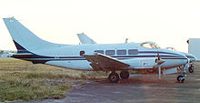 Airplane Picture - Riley Dove with Lycoming engines and taller swept fin at Long Beach airport in April 1987