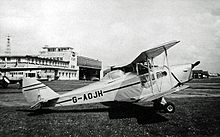 Airplane Picture - Canadian-built DH.83C Fox Moth with canopy fitted to pilot's position at Manchester (Ringway) Airport in 1955