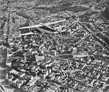 Airplane Picture - A Union Airways of New Zealand de Havilland D.H.86 flies over Dunedin.