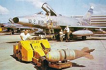 Airplane Picture - An F-100D of the 308th TFS, being loaded with Mk 117 750 lb bombs at Tuy Hoa, South Vietnam, in early 1966.