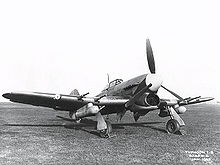 Airplane Picture - Unidentified early Typhoon with 45 gallon drop tanks and unfaired cannon; note the retractable step (above starboard wheel).