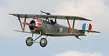 Airplane Picture - A Nieuport 17 in flight at a display in 2007. Insignia is of the Lafayette Escadrille. Note that this is a scaled-down replica, and not a full size aircraft.