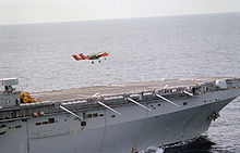 Airplane Picture - An OV-10A Bronco from VMO-1 takes off from the flight deck of the USSNassau(LHA-4) in 1983