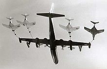 Airplane Picture - R3Y-2 Tradewind refuels a record four fighters in flight, 1956