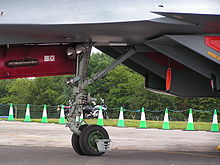 Airplane Picture - Nosewheel of the Su-30MKI showing that the diagonal linking strut on the flankers is mounted externally and fixed to the fuselage instead of the gear leg.