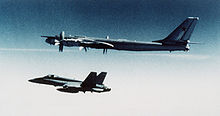 Airplane Picture - A Soviet Tu-95 Bear-H bomber being escorted by a Canadian Forces CF-188 Hornet in 1985.